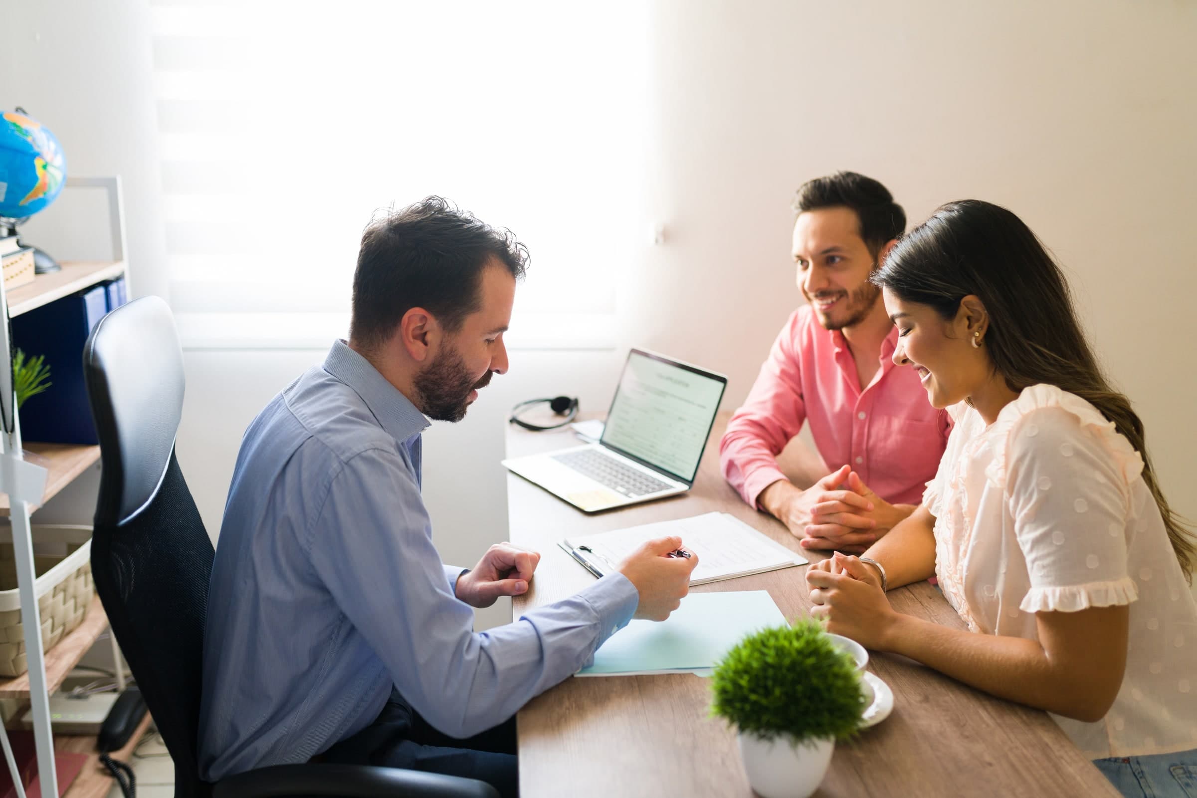 Travel consultant discussing a trip with a couple