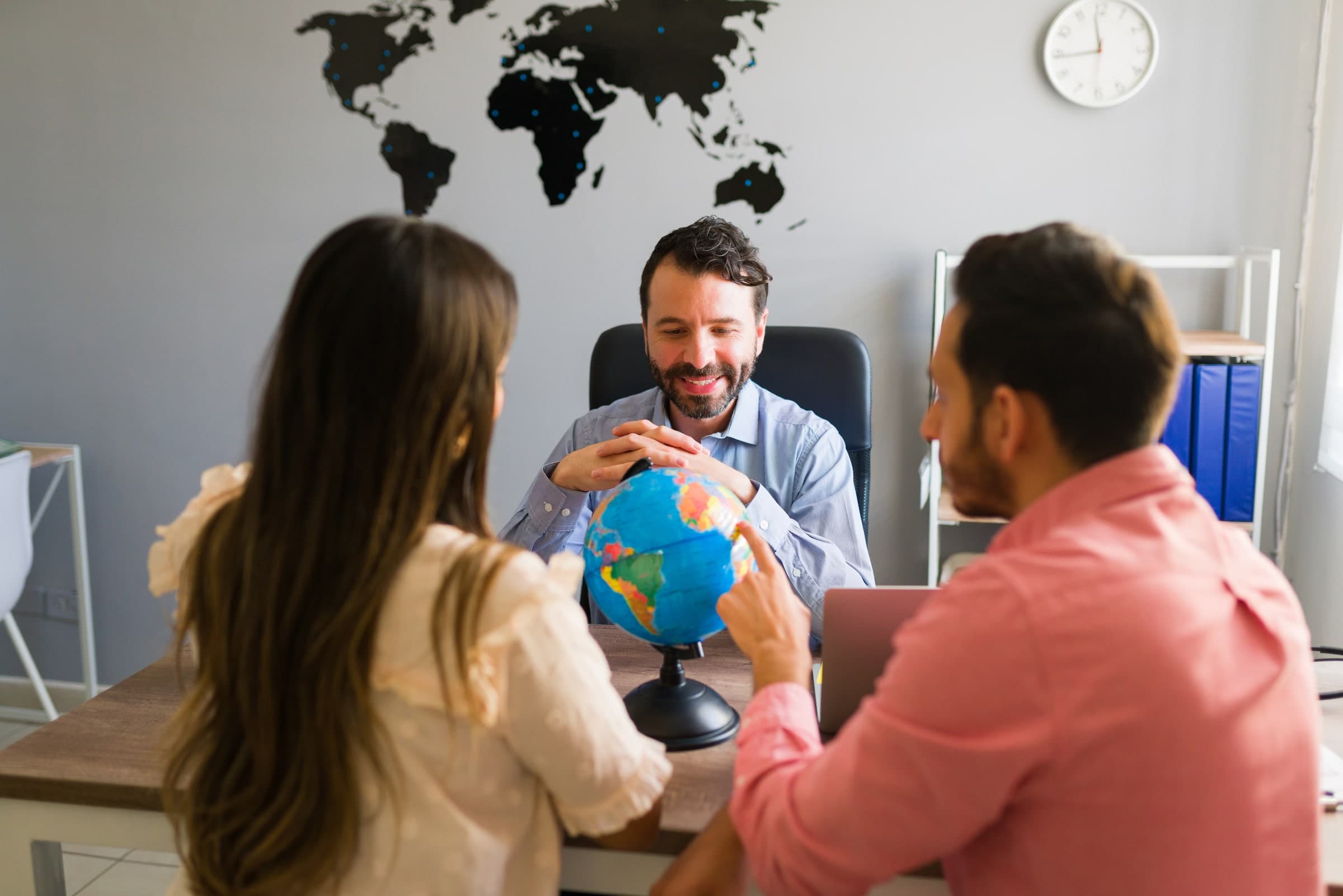 Couple planning a holiday with a travel consultant