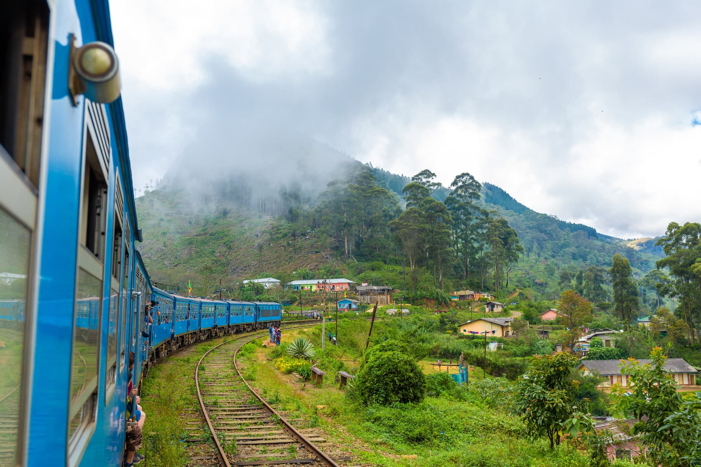 Blue train travelling through the Sri Lankan hill country