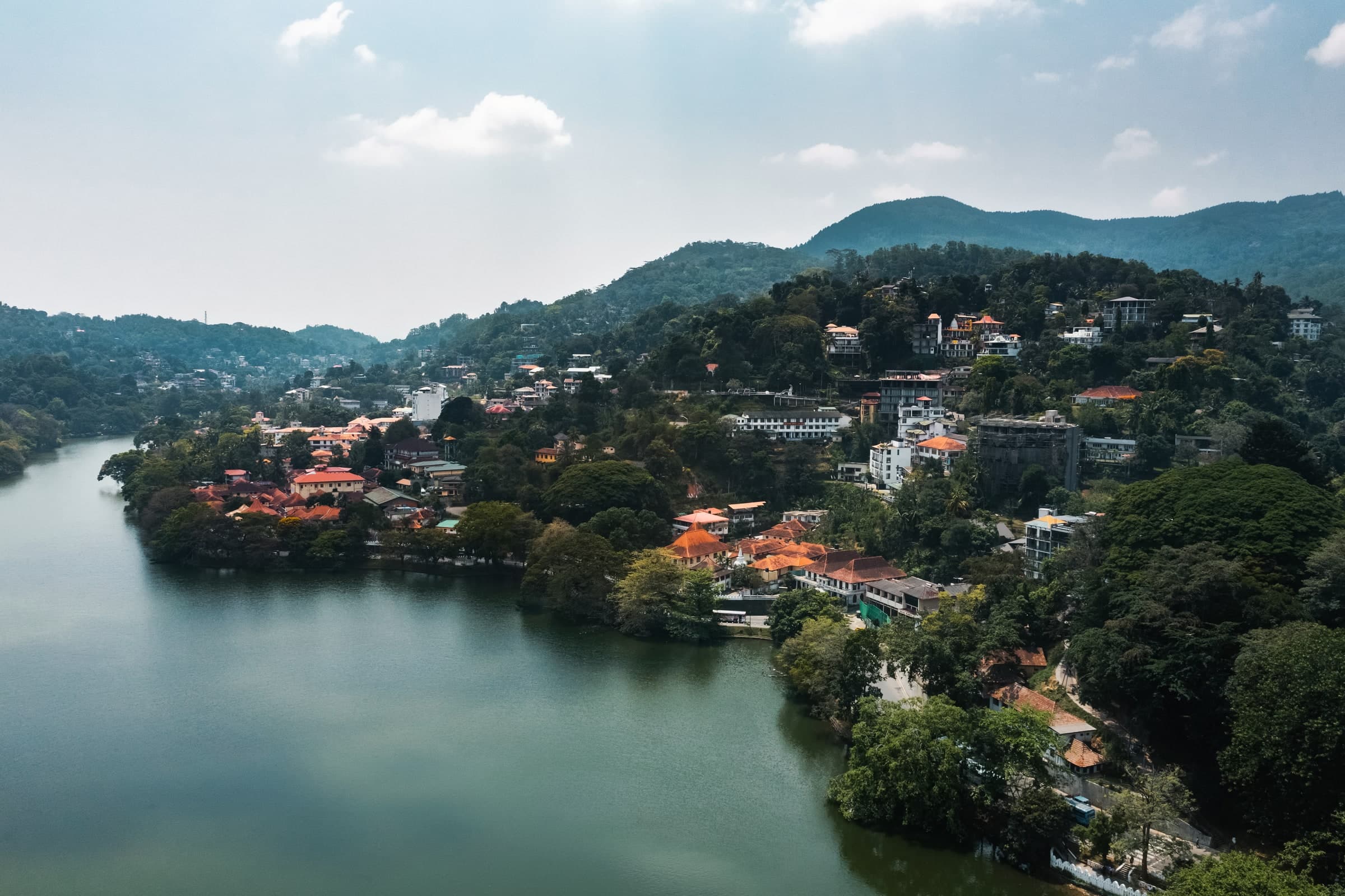 Aerial view of Kandy Lake, city buildings and surrounding green hills