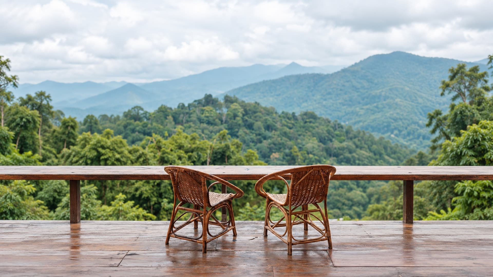 Two wicker chairs on a wooden balcony overlooking forested mountains, with AI-expanded surroundings