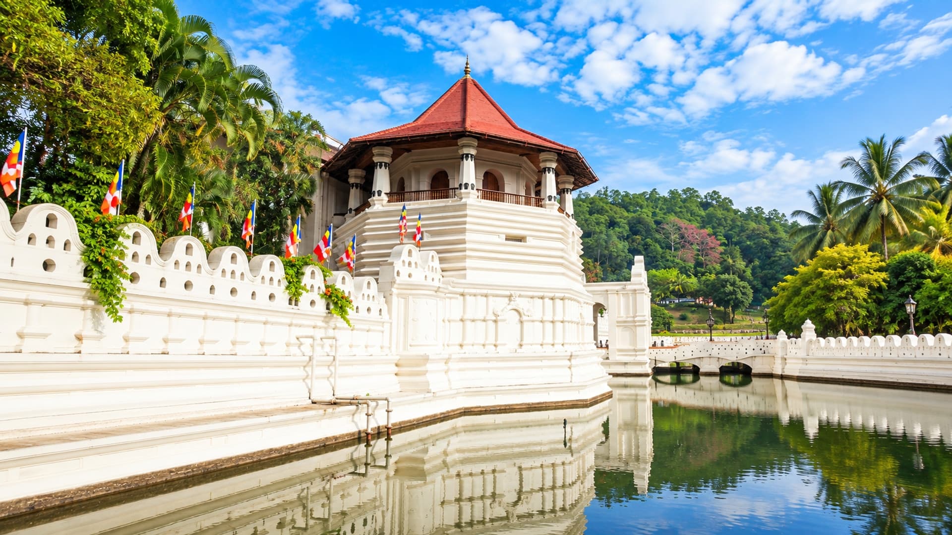 Temple of the Sacred Tooth Relic in Kandy, with its roof and base visible and AI-expanded surroundings