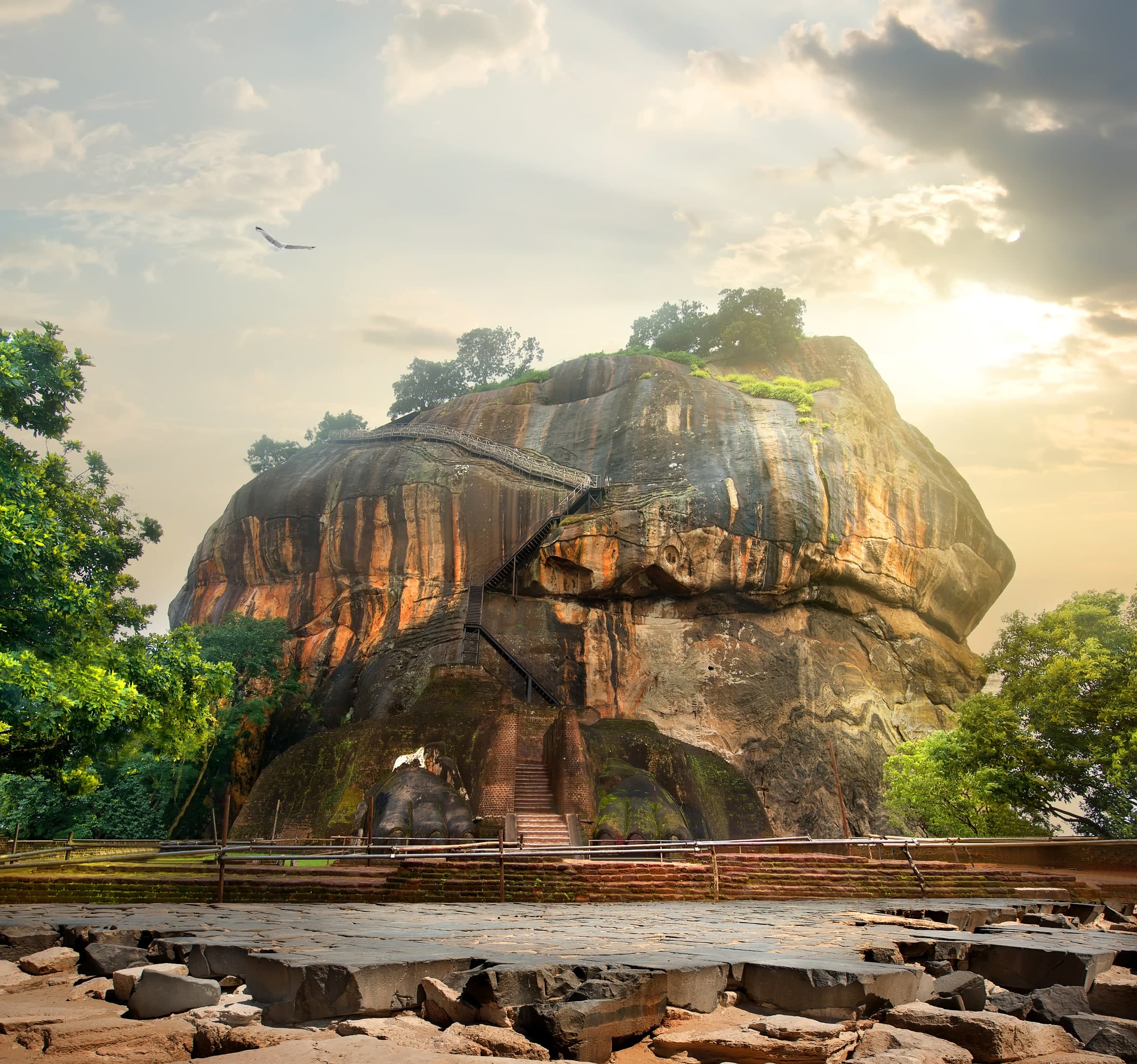 Sigiriya rock fortress framed by boulders and greenery